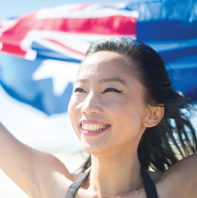 Asian Swimmer holding Australian Flag