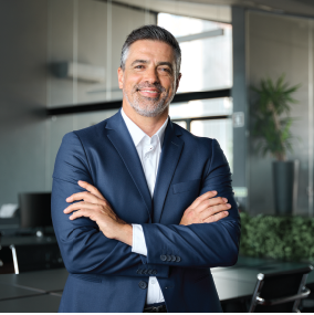 Corporate male worker standing in office